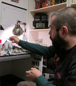 Eric Treadaway sculpting Ggripptogg's lower torso. 